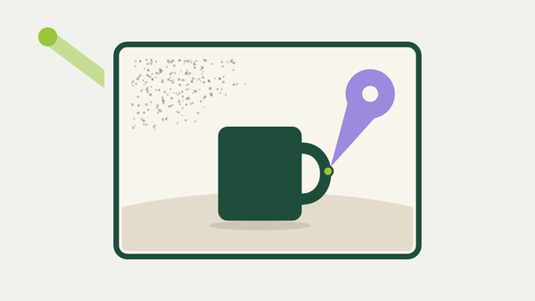 A product-shot frame with a comment pin pointed at a mug's handle and fine grain in the backdrop